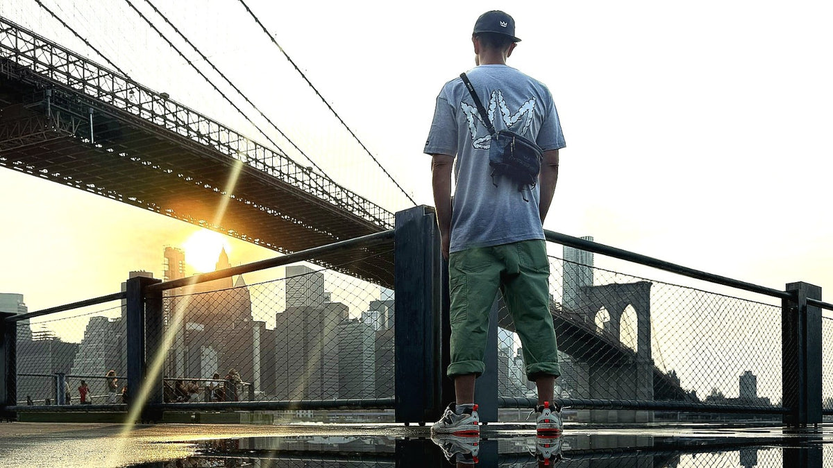 NY State of Mind Utility Waist Pack worn crossbody overlooking the Brooklyn Bridge and Manhattan skyline